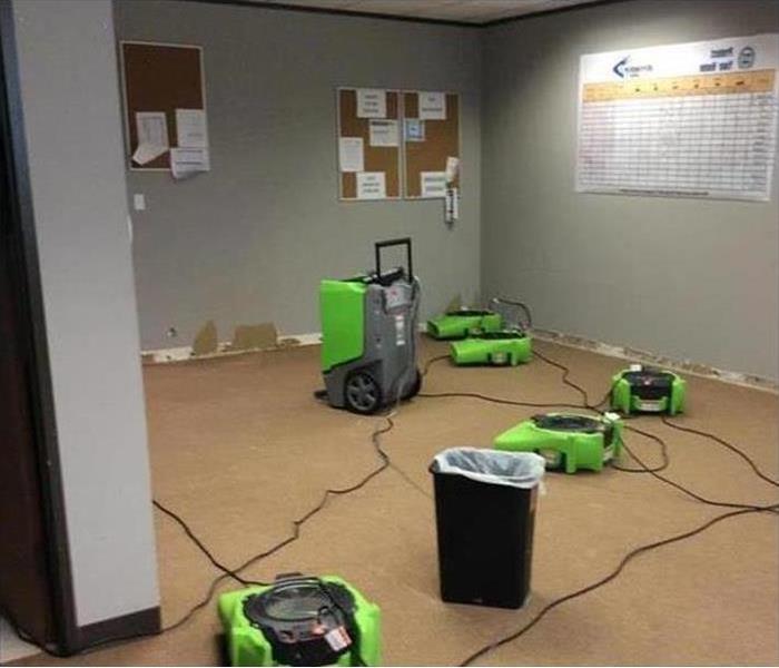 Dried office with greed fans and dehumidifiers 